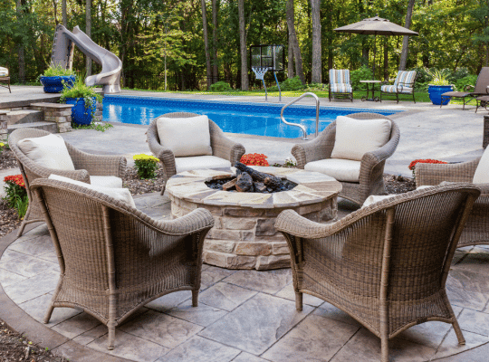 Elegant and durable concrete fire pit designed by Preferred Concrete Tampa, enhancing a Tampa home's outdoor space with a stylish and functional focal point.
